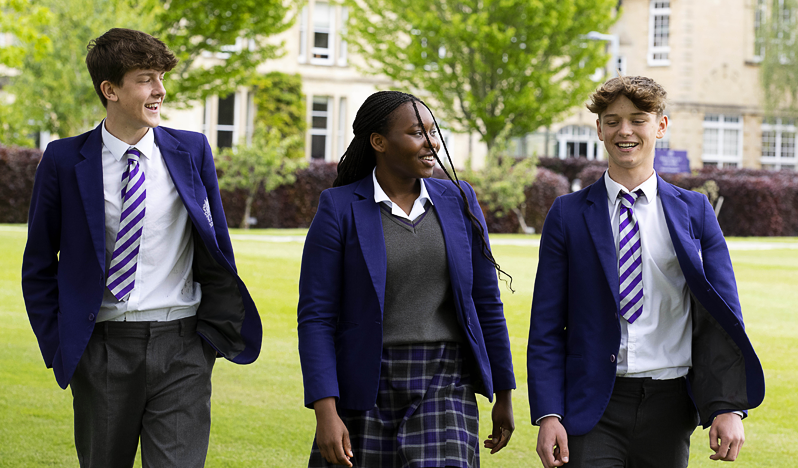 International students walking and chatting through the grounds at UK boarding school, Wycliffe College
